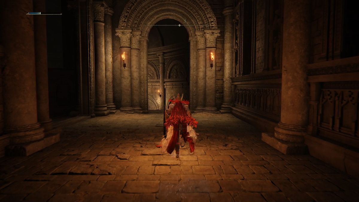 A red-cloaked Elden Ring character runs through a passageway