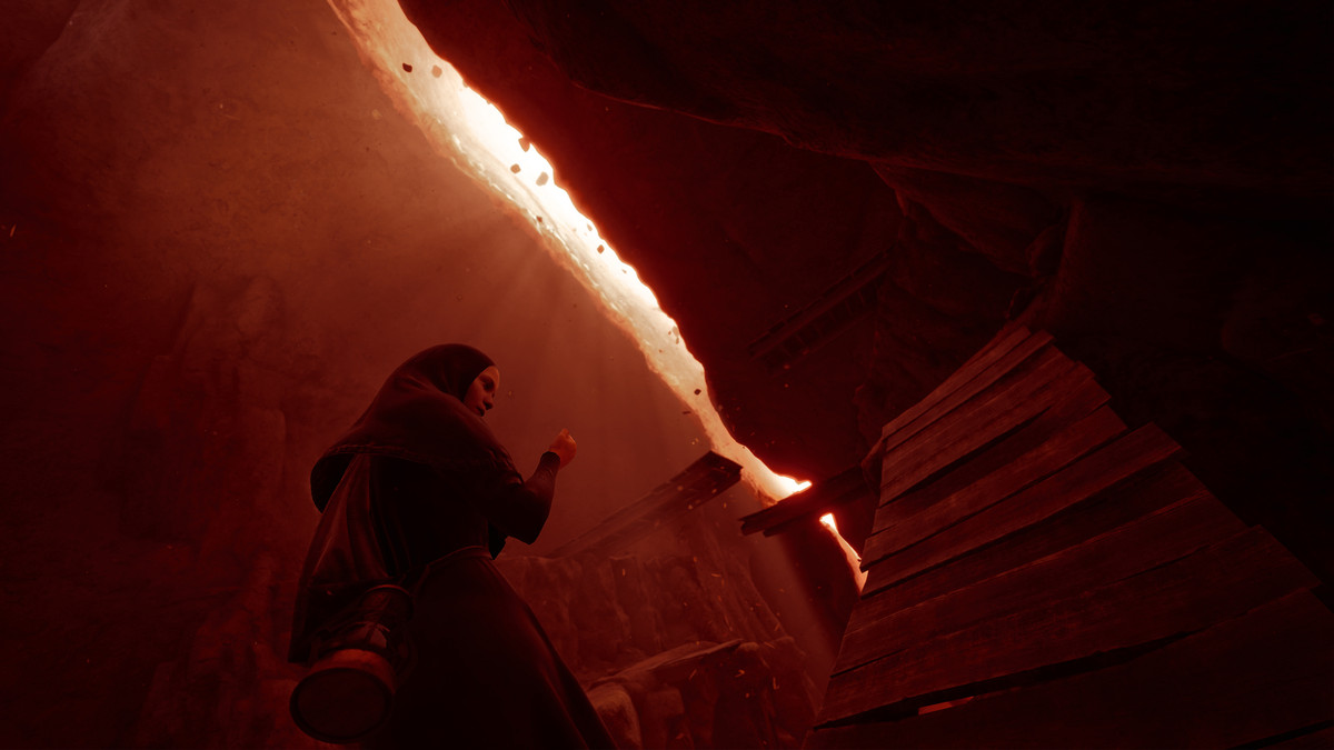 A nun bathed in red light in arthouse game Indika.