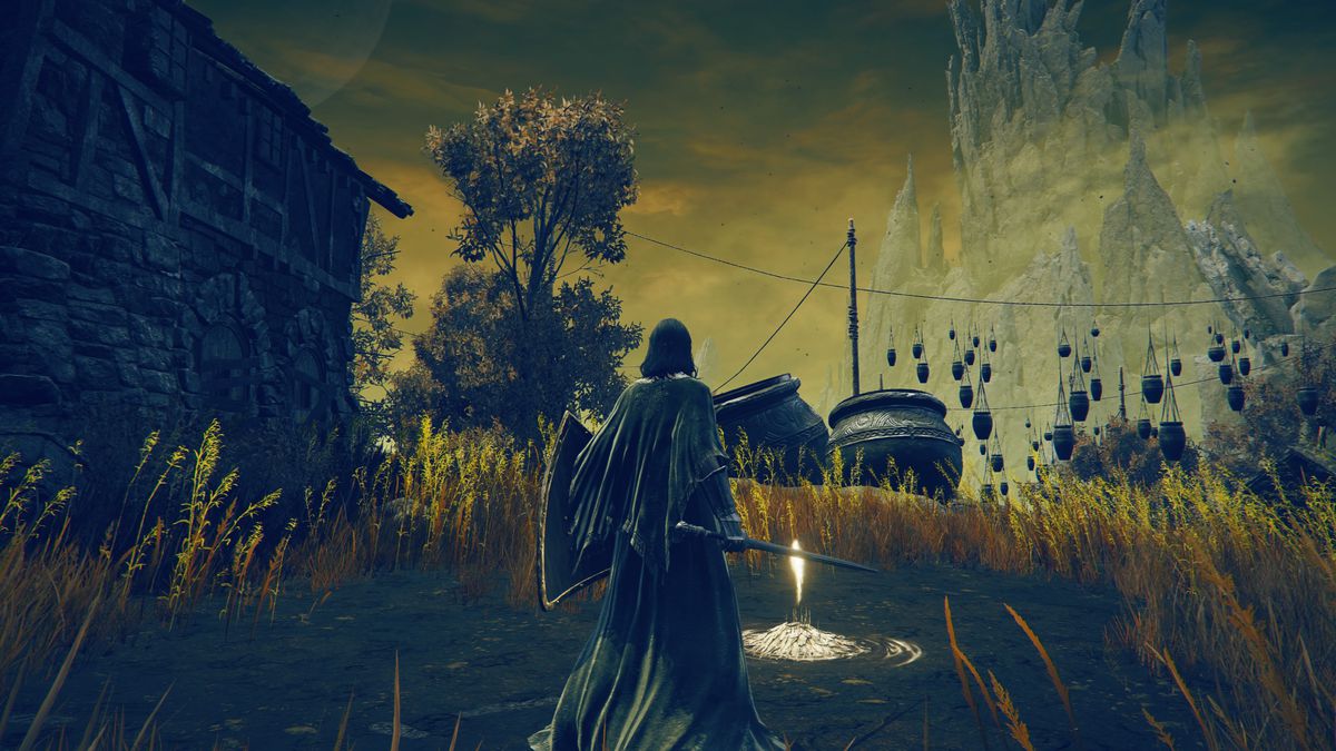 A Tarnished warrior stands in front of the Bonny Village site of grace, with many pots in the background, in a screenshot from Elden Ring: Shadow of the Erdtree